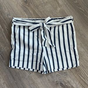Navy and white striped shorts with tie belt